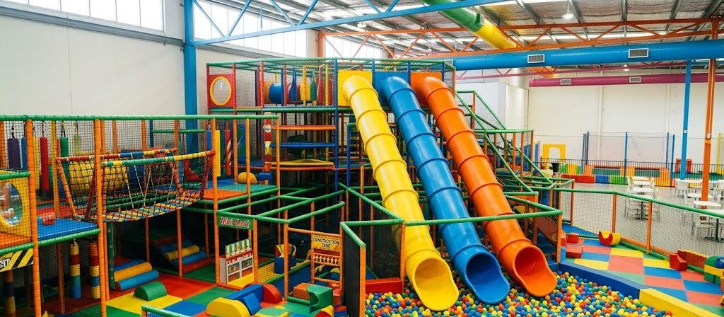 Colourful indoor play centre with soft play frames, slides and a ball pit in Melbourne